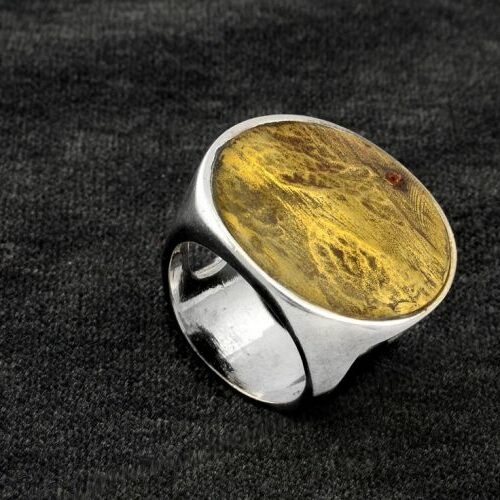 Anello in argento con placca in bronzo cesellato. Epoca anni '70.
