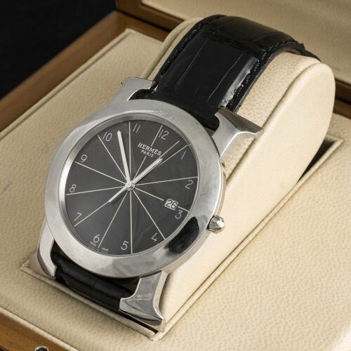 Orologio uomo in acciaio mm. 40 con datario, 2 cinturini in pelle. Scatola e garanzia. Hermès