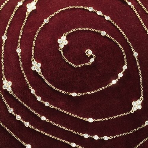 Lunga collana in oro giallo alternata a diamanti per totali ct. 10.